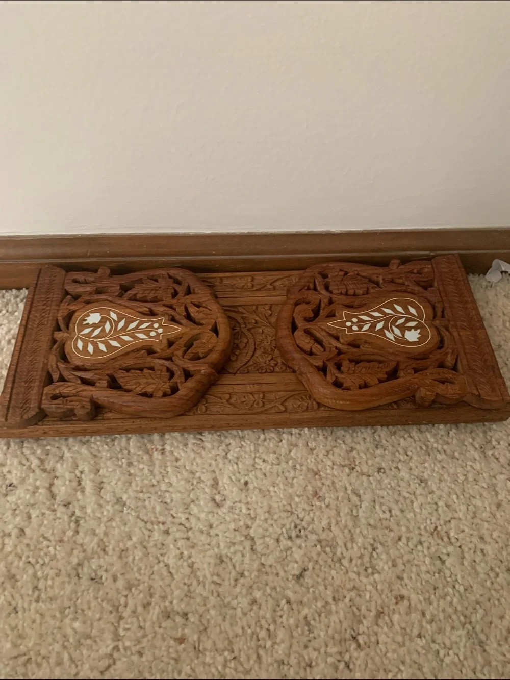 Vintage hand carved expanding book rack.